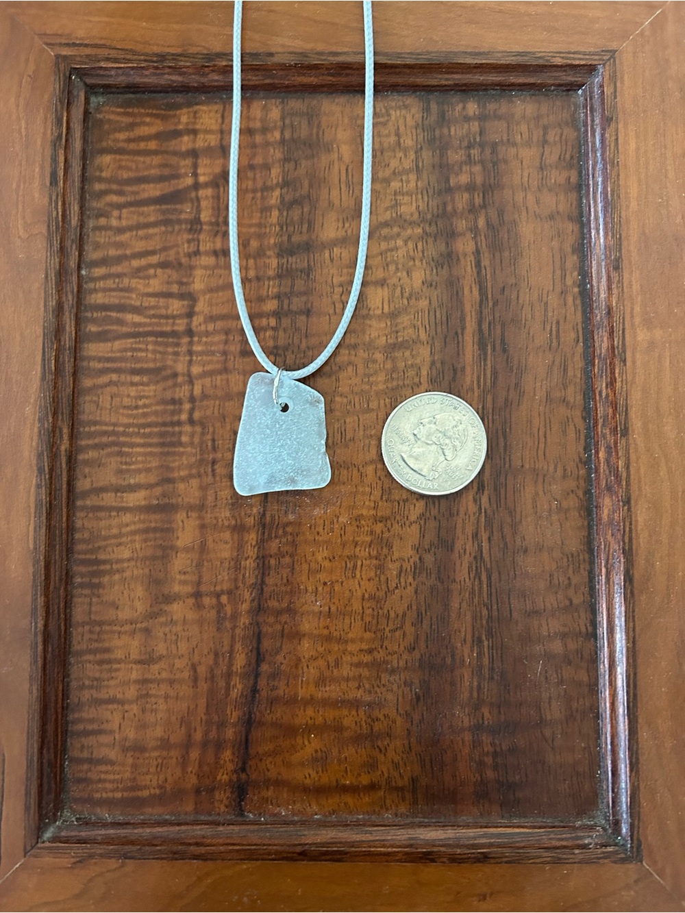 Light blue sea glass pendant on 18-inch light blue cord